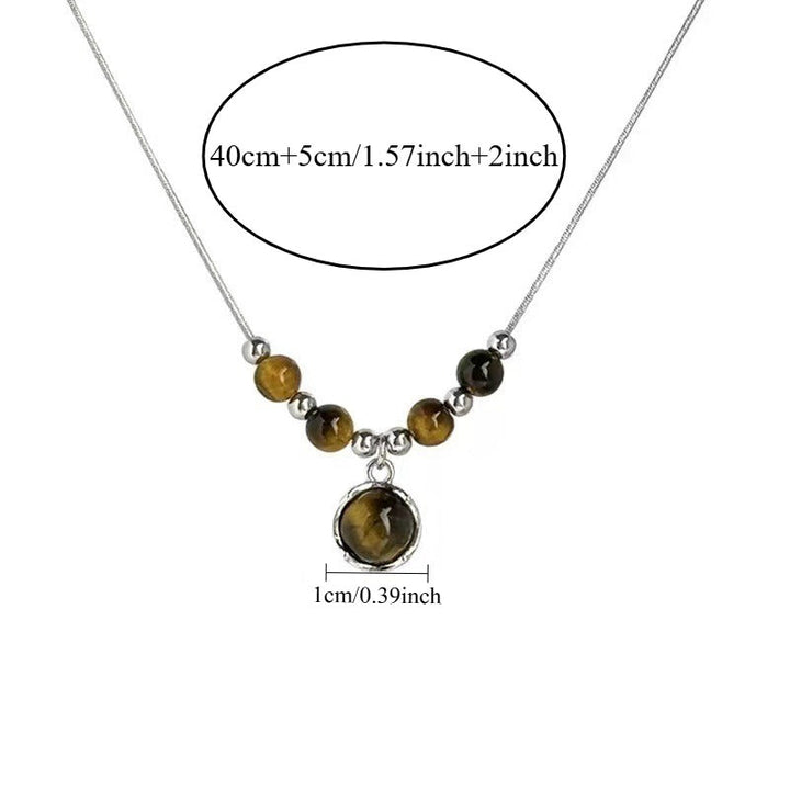 Lucia | Collar de Ojo de Tigre con Colgante Circular y Elegancia Atemporal